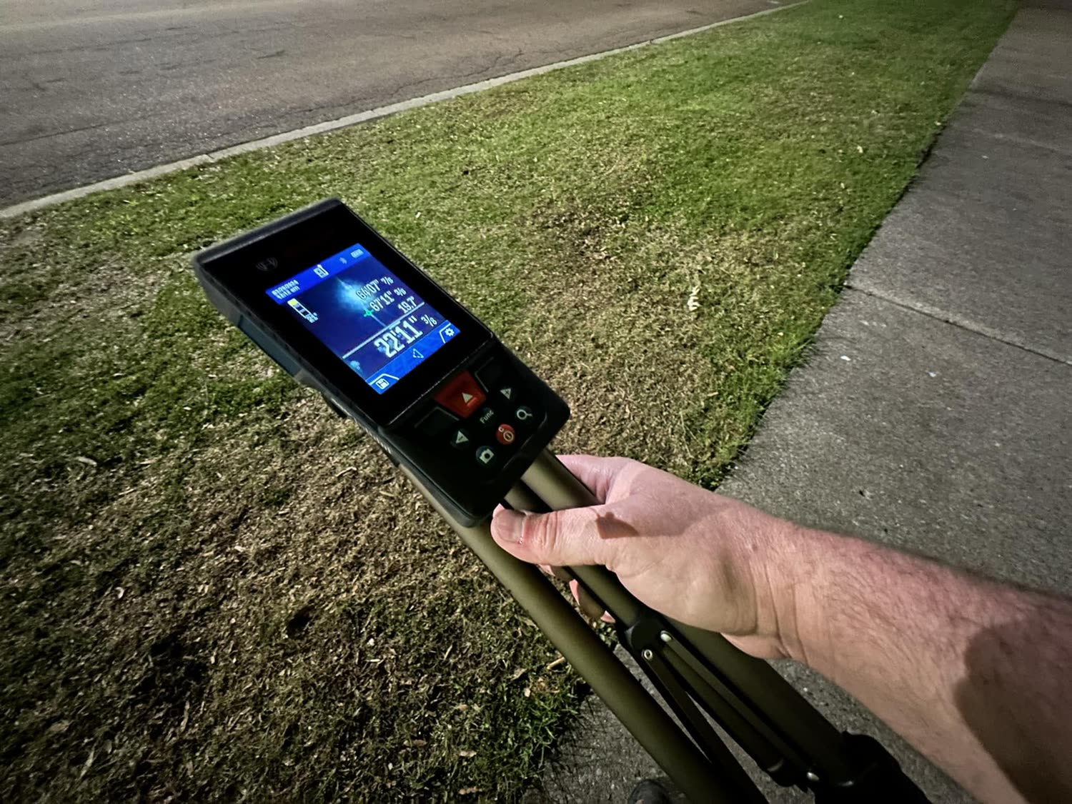 A technician measuring a business site